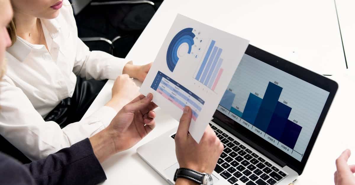 business professionals discussing data charts and graphs in a modern office setting 1